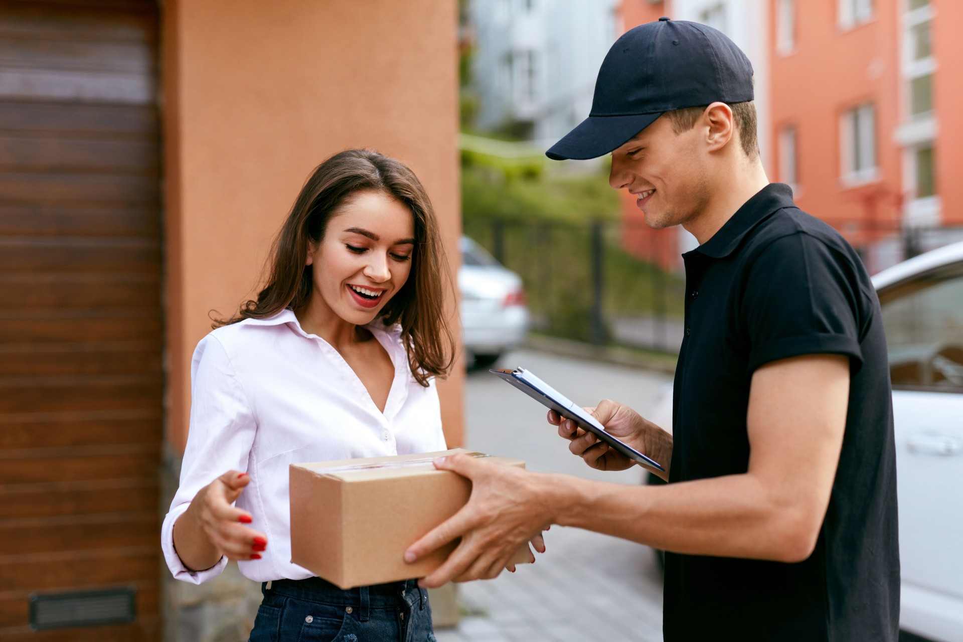Express Delivery Service. Courier Delivering Package To Woman